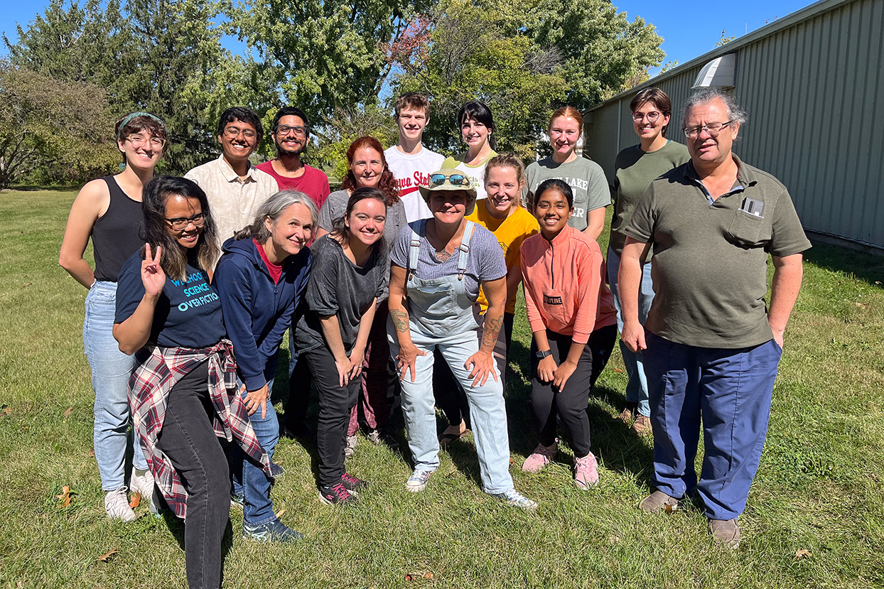 Good Earth Student Farm volunteers pose for a photo at the ISU Horticulture Research Station north of Ames. The group grows and harvests crops from beneath two high tunnels at the station.