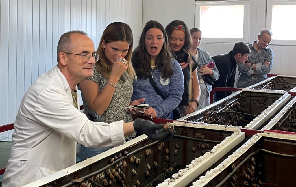 The CALS group touring a snail farm.